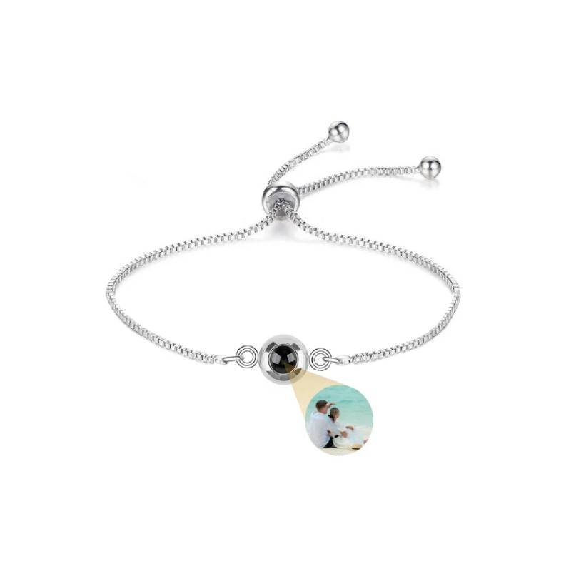 Bracelet with a photo charm on a white background
