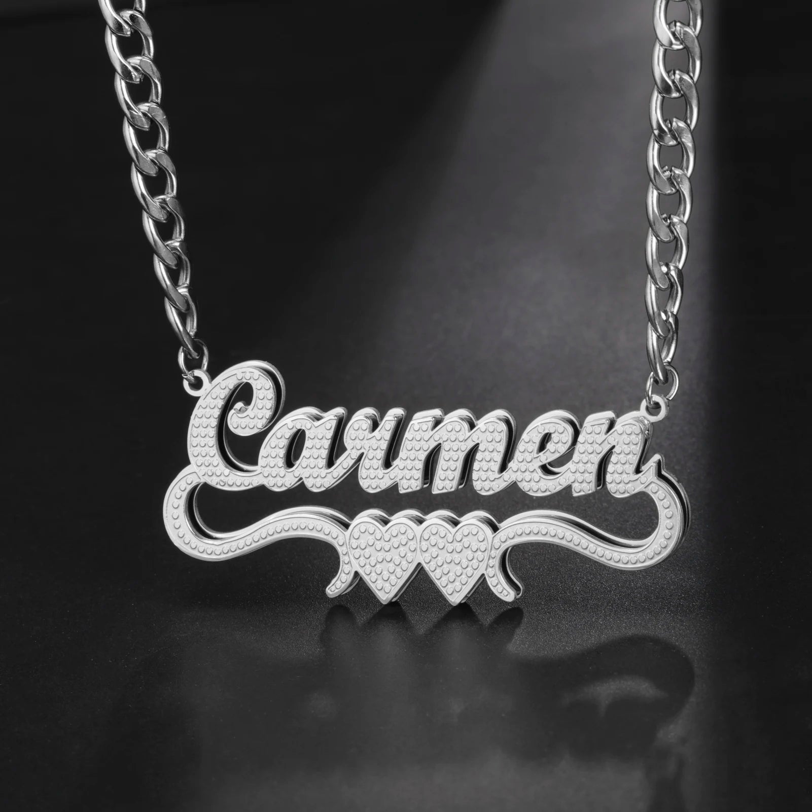 Silver name necklace with 'Lauren' on a dark background