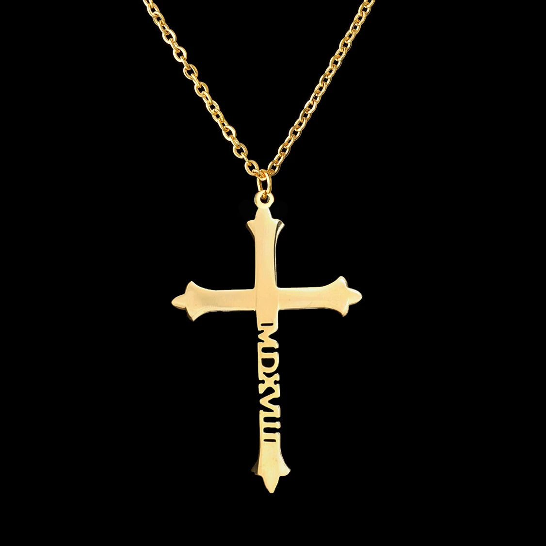 Gold cross pendant with Roman numerals on a black background