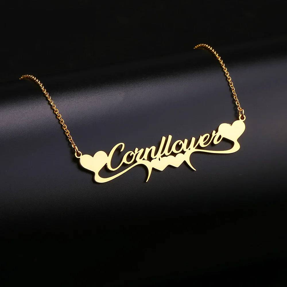 Gold necklace with 'Cornflower' inscription on a dark background