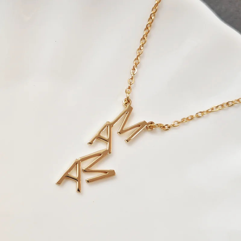 Gold necklace with 'AMAZING' pendant on a white background