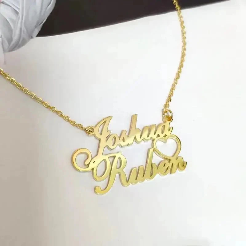 Gold name necklace with 'Joshua Roberto' on a white background