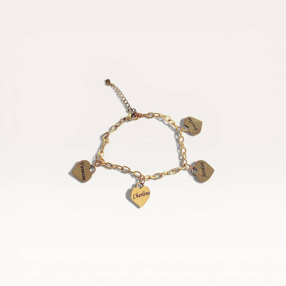 Gold bracelet with heart-shaped charms on a light beige background