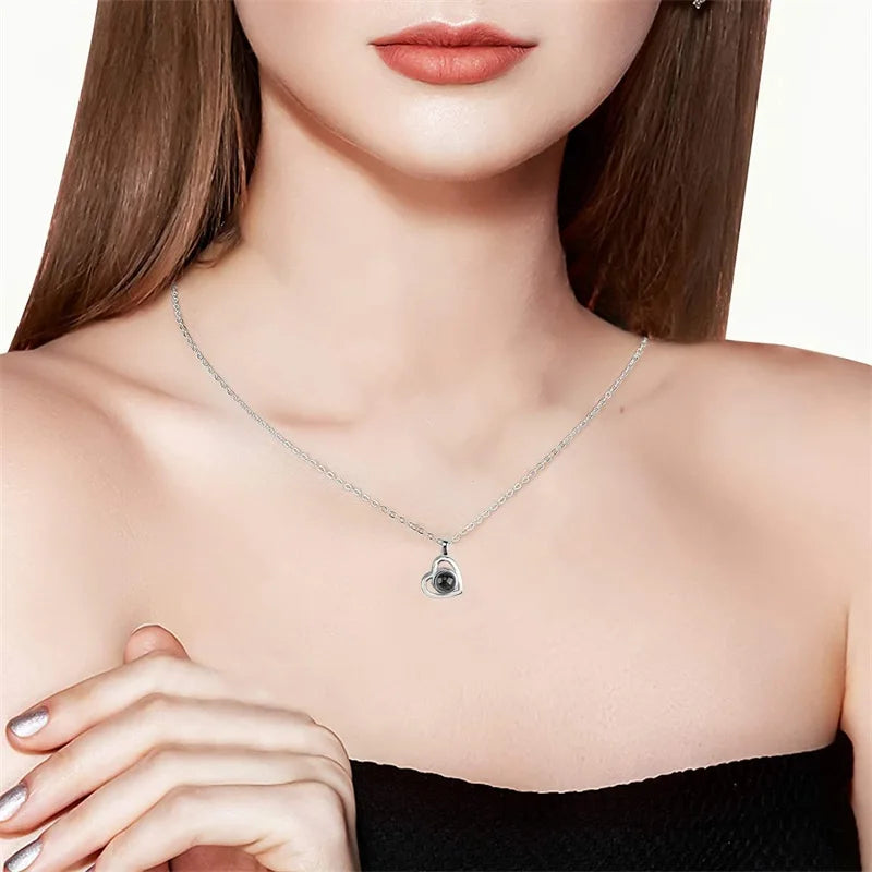 Necklace with a pendant worn by a model on a white background