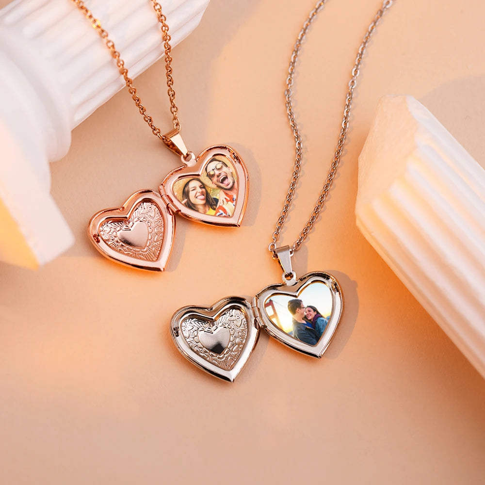 Heart-shaped photo locket necklaces on a soft peach background