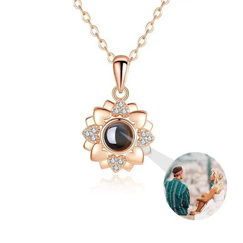 Rose gold necklace with a floral pendant on a white background