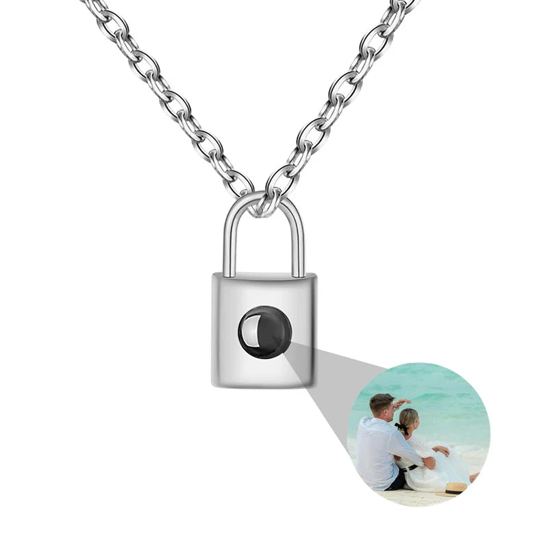 Lock-shaped photo locket with a chain on a white background
