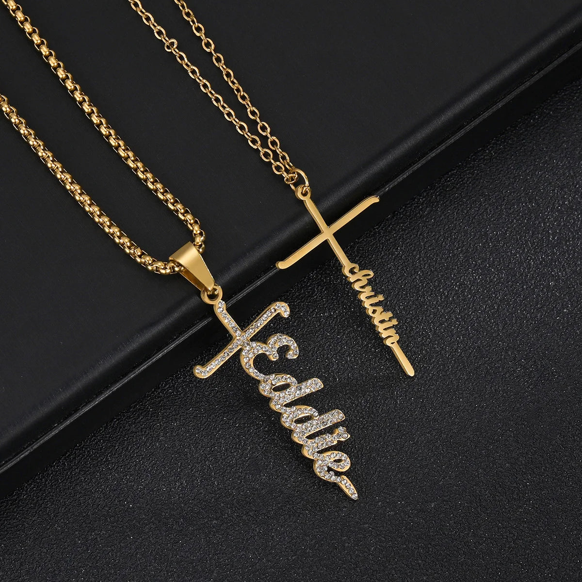 Gold necklace with name pendant on a black background